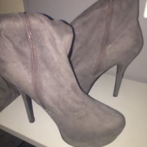 Gray knee high heeled boots by Charlotte Russe